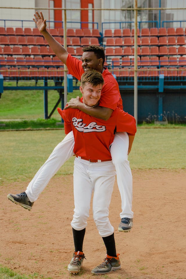 Baseball teammates celebrating success.